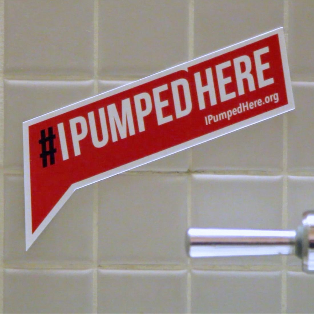 I Pumped Here sticker on bathroom stall